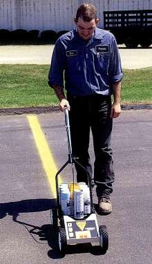 Striper holds a case of paint.