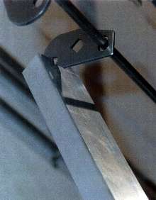 Conveyor Hook holds metal parts to be painted.