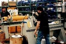 Slitter cuts large rolls of material down to size.
