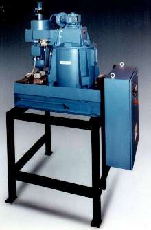 Centrifuge removes grinding solids from coolant and oil.
