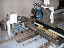 Stacking/Loading Machine handles ground E core magnets. Stacking/Loading Machine handles ground E core magnets.