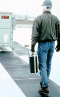 Roof Traffic Pads provide impact-absorbing walkway.