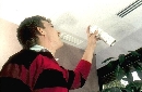 Restorer makes ceiling tiles look new.