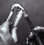 Adhesive is removed with acetone or ketone solvents.