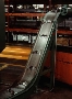 Magnetic Slide Conveyors move stamping parts and scrap.