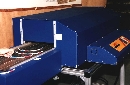 Controller varies conveyor speed of ovens.