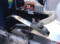 Label Printer applies four-color labels and bar codes.