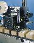 Label Printer-Applicator applies labels to boxes on conveyors.