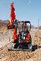 Excavator operates in space-restricted areas.
