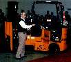 Gas-Powered Forklift maneuvers in narrow aisles.