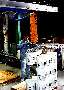 Vacuum Tube Lifter palletizes 5-gal pails.