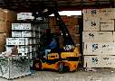 Forklift Truck reaches forward with telescopic boom.
