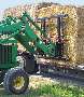 Bale Handler stacks large rectangular bales.