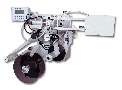 Tamp Labeler provides pressure sensitive labeling.