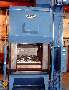 Steel Belt Tumble Blaster handles large, hot castings.