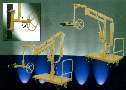 Manipulator includes gripping and rotating attachment.