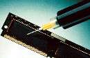 Epoxy encapsulates microelectronic chips.