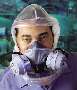 Respirator protects wearer against harmful chemicals.