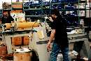 Slitter cuts large rolls of material down to size.