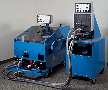 Machine drives fasteners into steel and aluminum sheets.