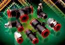 Fittings connect tubes to pneumatic components.