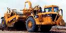 Wheel Tractor Scrapers have dual power capabilities.