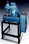 Centrifuge removes grinding solids from coolant and oil.