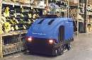 Rider Cleaning Machine provides sweeping and scrubbing.