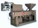 Thermoplastic Extruder features swing-arm controls.