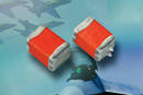 Solid Tantalum Chip Capacitors work with +28 V power supplies.