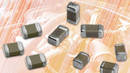 Automotive SMD MLCCs conserve space and operate up to +150°C.