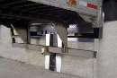 Recessed Vehicle Restraint secures trailers at dock.