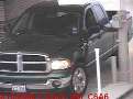 Camera System takes pictures of vehicles in drive-up lanes.
