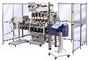 Package Printing Machinery decorates asymmetrical bottles.