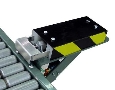 Pusher mounts to many conveyor models.