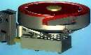 Machine facilitates finishing/deburring of metal parts.