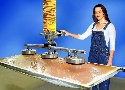 Vacuum Tube Lifter picks up shrink-wrapped panels.