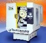 Vertical Machining Center cuts graphite EDM electrodes.
