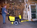 Powered Cart pushes heavy wheeled loads.