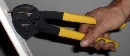 Pliers facilitate extraction of exposed nails.
