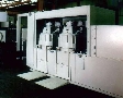 Centrifuge removes fine grinding solids from oils.