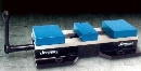 Vises provide quick change fixturing.