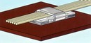 Clamp accommodates various cable shapes and components.