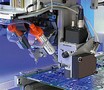 In-Line Dispenser accommodates up to 6 dispense heads.