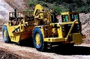 Tractor-Scraper comes equipped with bowl or auger.