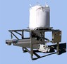 Bulk Bag Discharger includes tube style vibratory feeder.