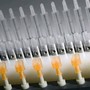 Corona System treats plastic needle hubs.
