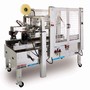 Stainless Steel Case Sealer handles 28 cases/minute.