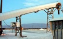 Metal Conveyor Covers are custom-curved to application.