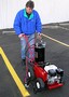 Paint Striper sprays lines, curbs, car stops, and stencils.